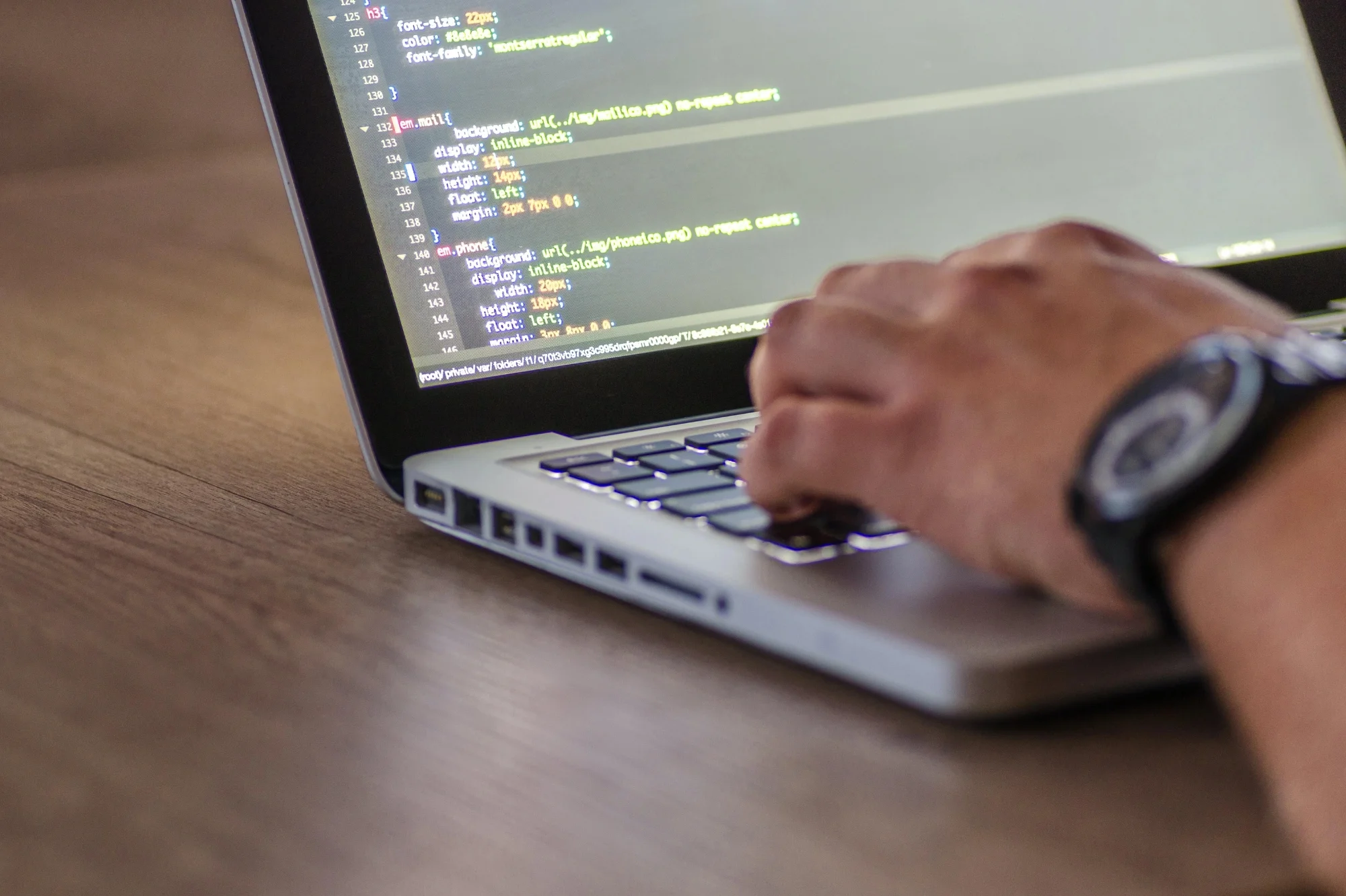 man coding on computer